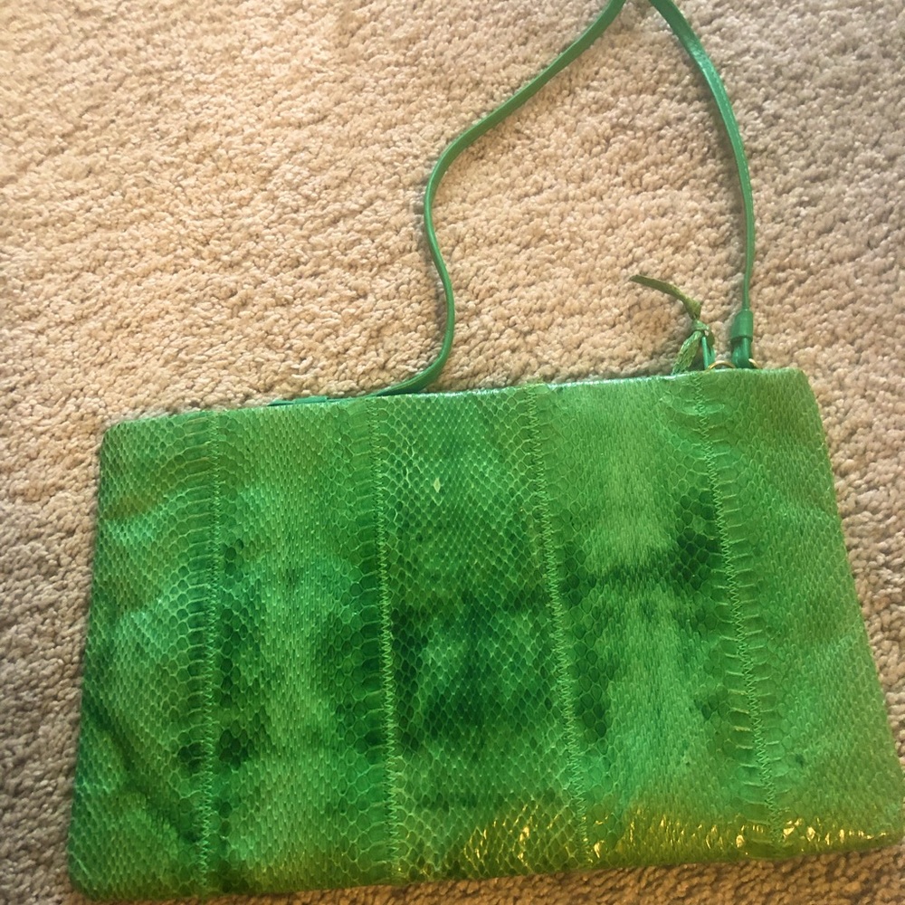 Snake skin clutch with hideable strap